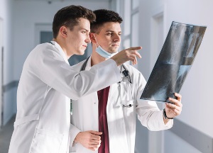 x ray tech and doctor reviewing x ray